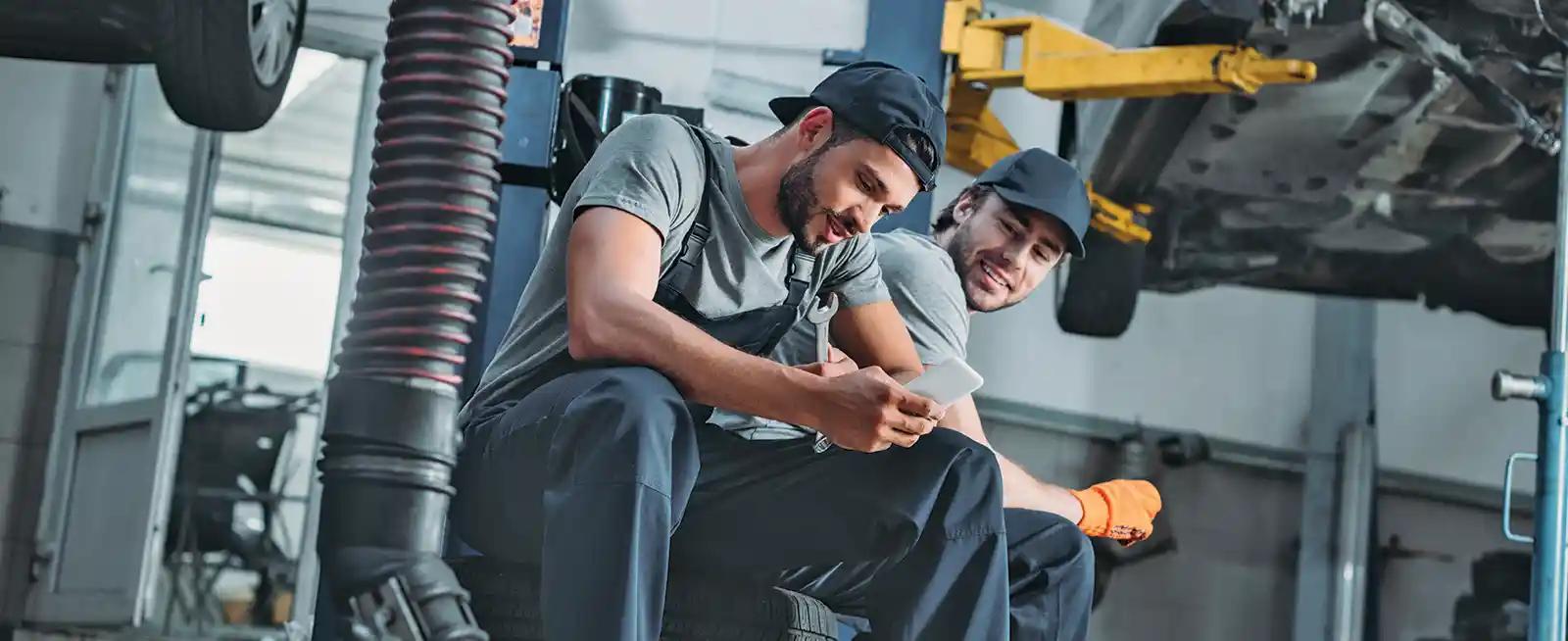 Automotive mechanics studying for an ASE certification test